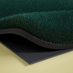 Synthetic turf fringe and rubber base detail of the putting green