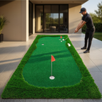 Golfer practicing on the three-hole putting green on a modern patio